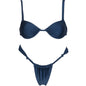 A woman standing by a poolside wearing a navy blue bikini suit with a solid color pattern, featuring a top with steel bracket support and briefs.