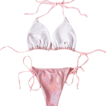 Pink and white bikini set with snake print bottom on white background