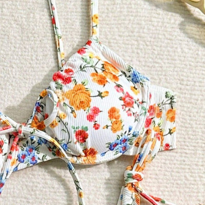 Floral-patterned bikini top on a textured surface