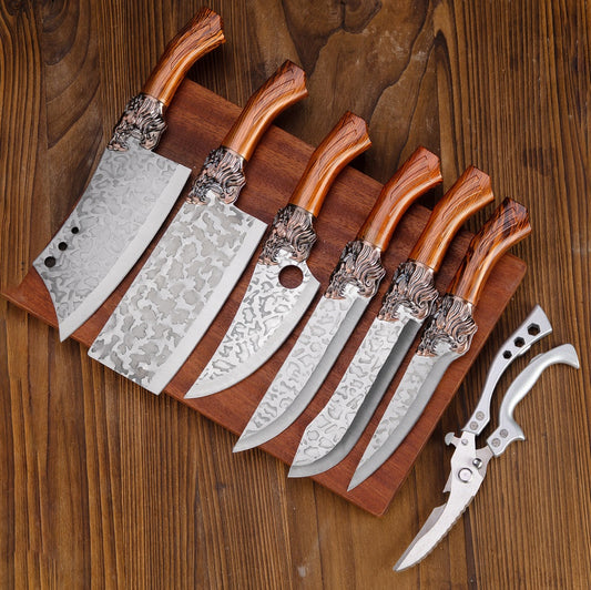 A set of kitchen knives with wooden handles and decorative metal accents on the blades, displayed side by side.
