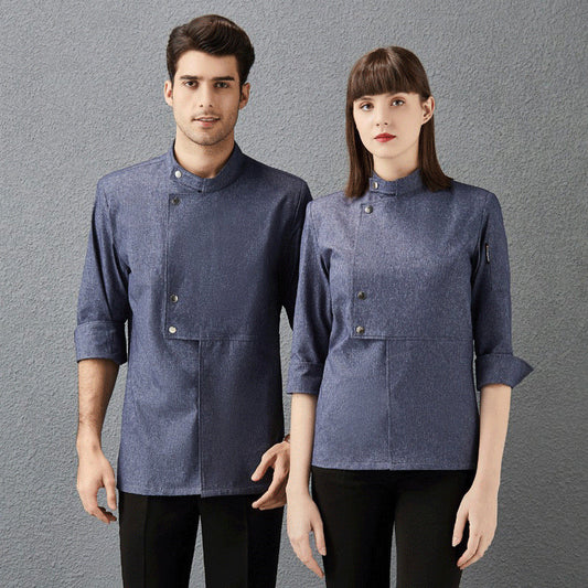 A male and a female model wearing gray chef overalls with three-quarter sleeves, standing against a gray background.