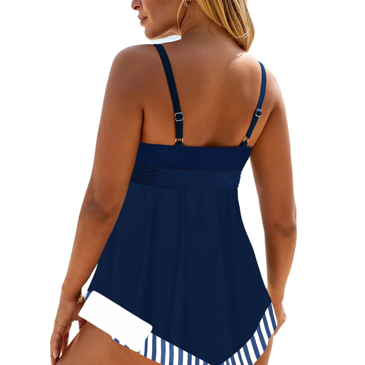 Navy blue dress with white and blue striped hem, worn by a person.