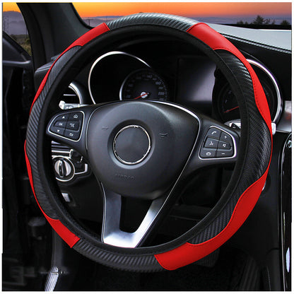 A carbon fiber and red leather steering wheel cover installed on a car steering wheel.