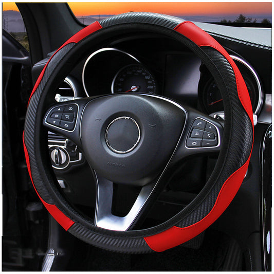 A carbon fiber and red leather steering wheel cover installed on a car steering wheel.