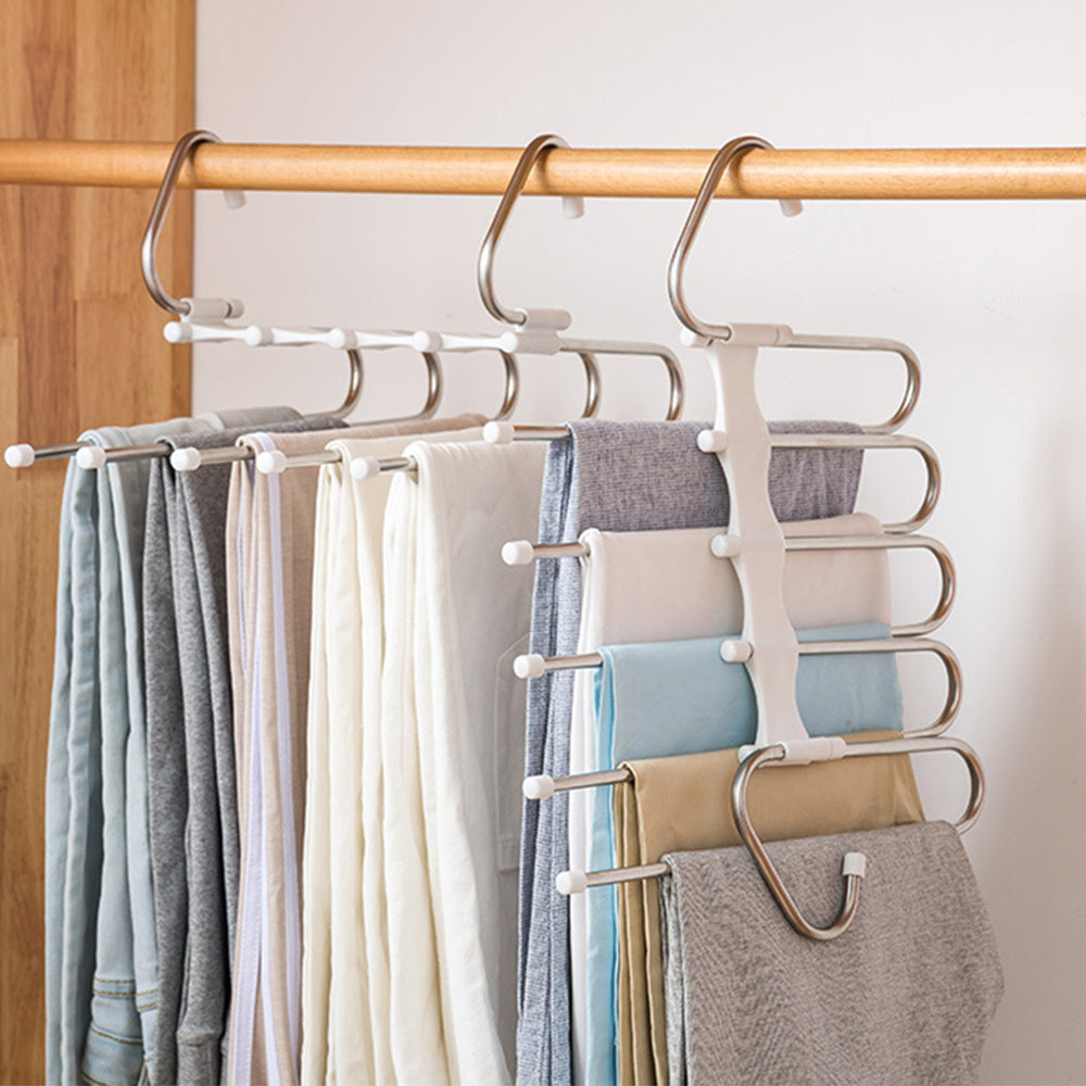A set of stainless steel multi-functional clothes hangers designed to hold various garments, displayed in a wardrobe environment.