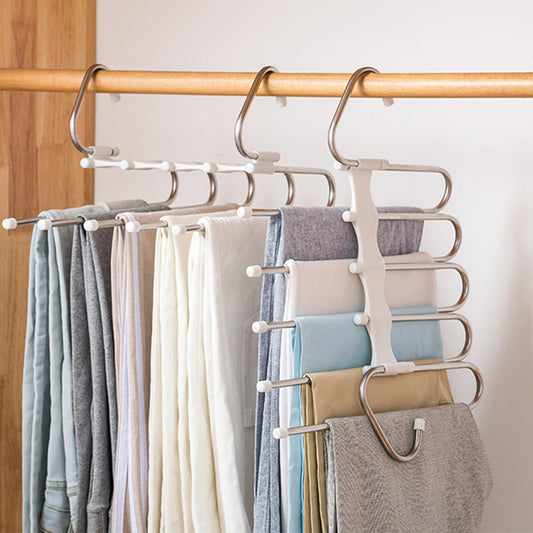 A set of stainless steel multi-functional clothes hangers designed to hold various garments, displayed in a wardrobe environment.