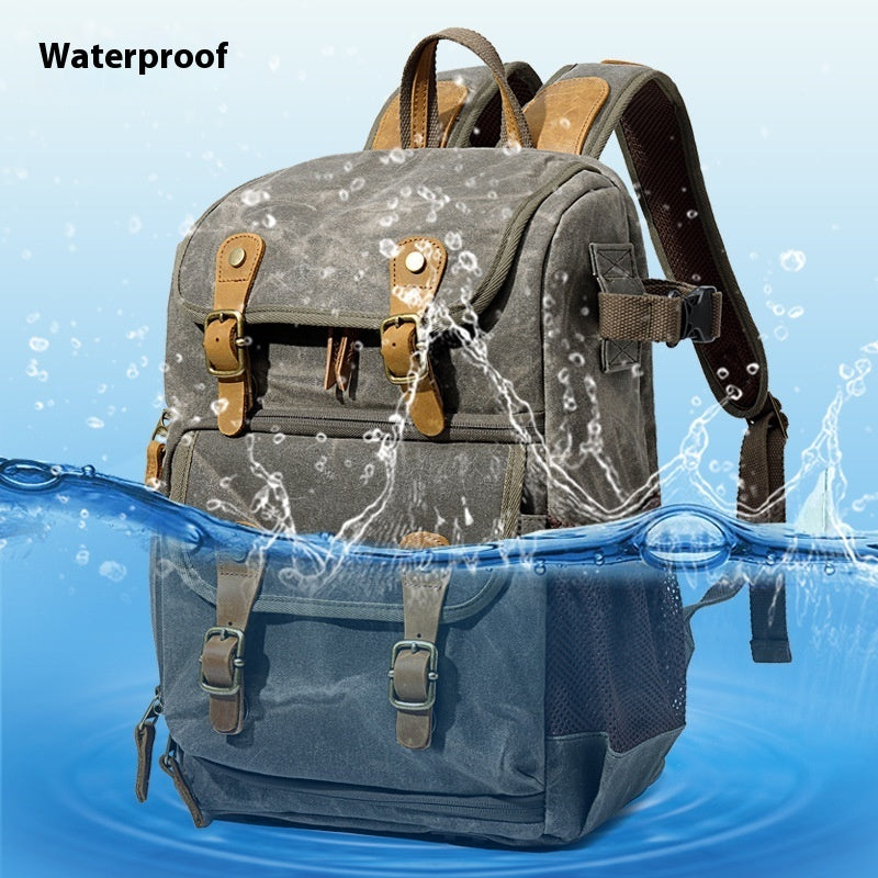 A gray and green Kalier digital SLR camera backpack with leather straps, displayed with a water splash indicating its waterproof feature.