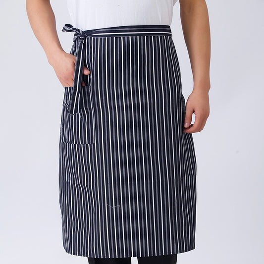 A person wearing a black and white striped chef apron with a tie at the waist.