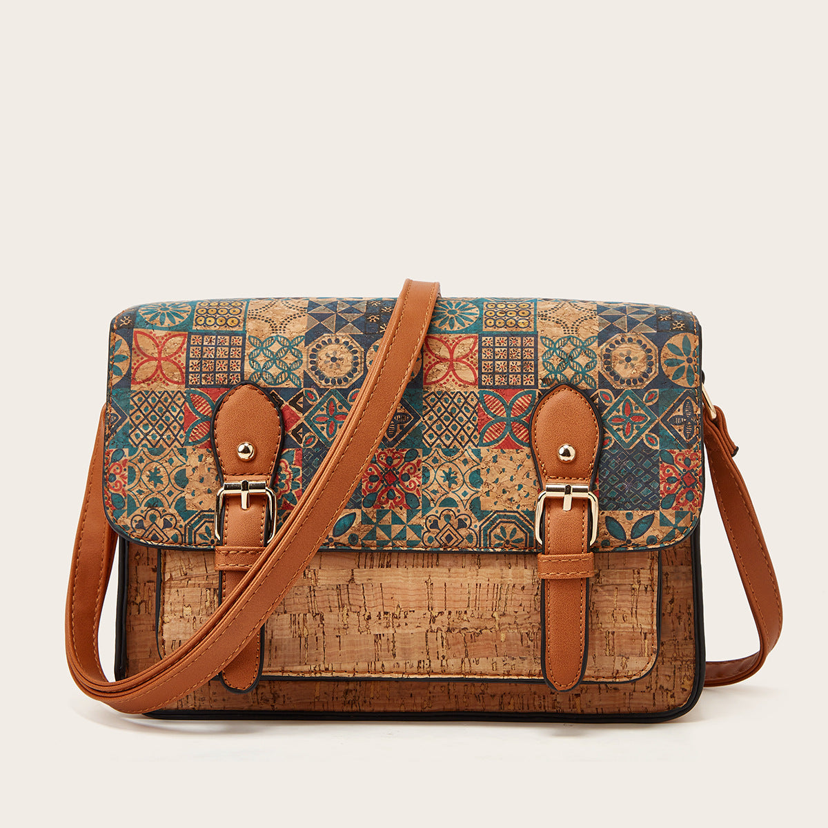 A brown and green faux leather one-shoulder crossbody bag with a printed design and a single shoulder strap.