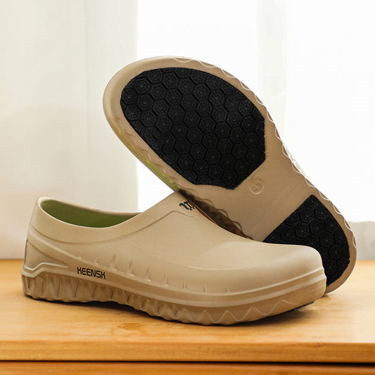A pair of beige non-slip chef shoes with EVA material, displayed on a wooden surface with a white curtain in the background.