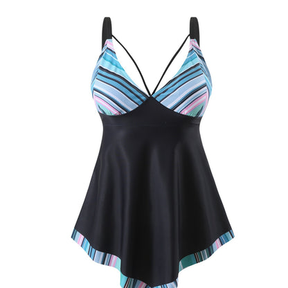 A model wearing a plus-size two-piece swimsuit in blue with white stripes, designed for swimming and wading.