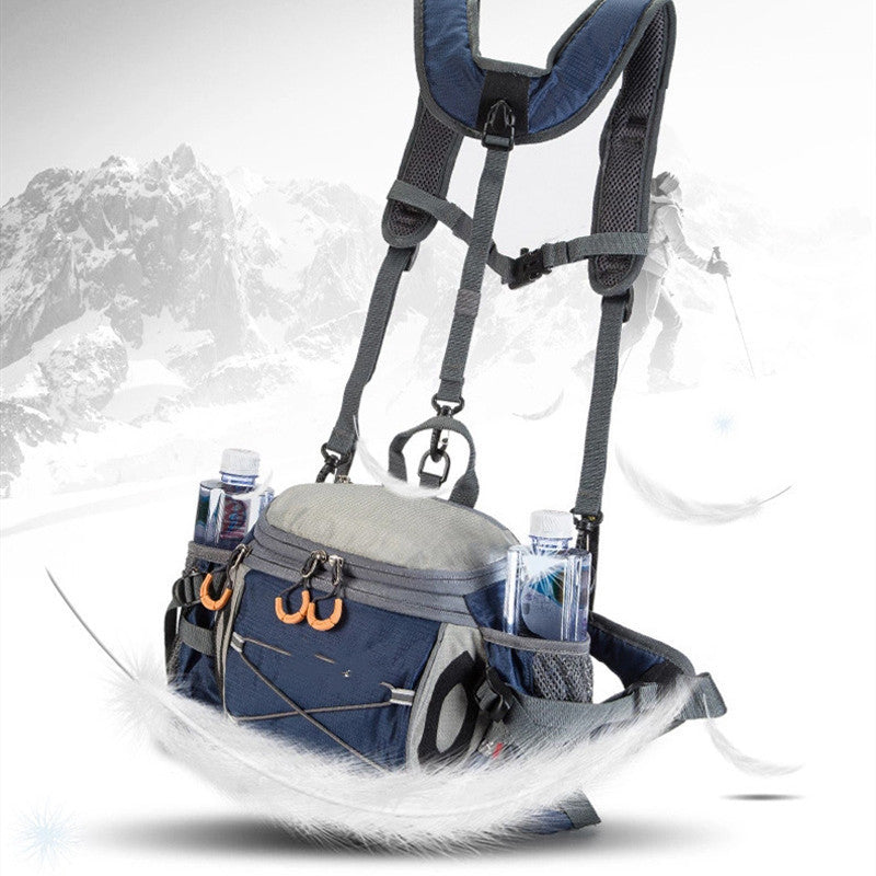 A blue and gray fanny pack with multiple compartments and shoulder straps, displayed against a mountainous backdrop.