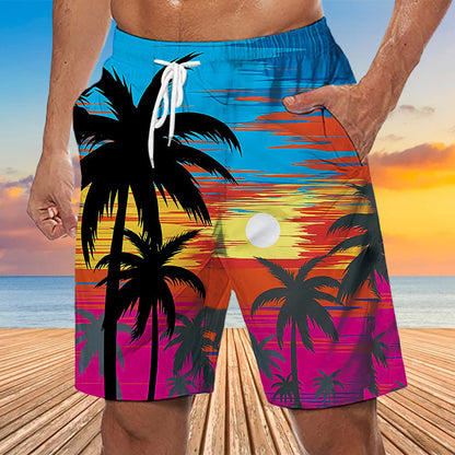 A pair of men's swimming shorts with a vibrant tropical design featuring palm trees and a colorful sunset pattern.