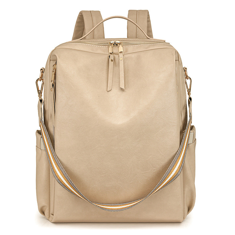 Beige backpack with a shoulder strap on a white background