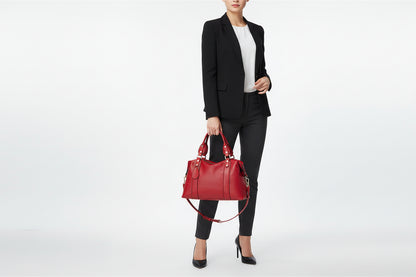 A wine red PU leather handbag with a lychee pattern, featuring a shoulder strap, two handles, and gold-tone hardware.