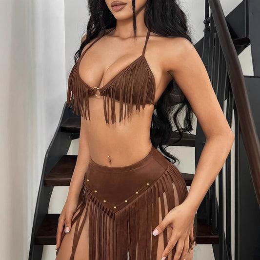 A woman wearing a brown tassel hanging neck backless vest set with matching skirt.